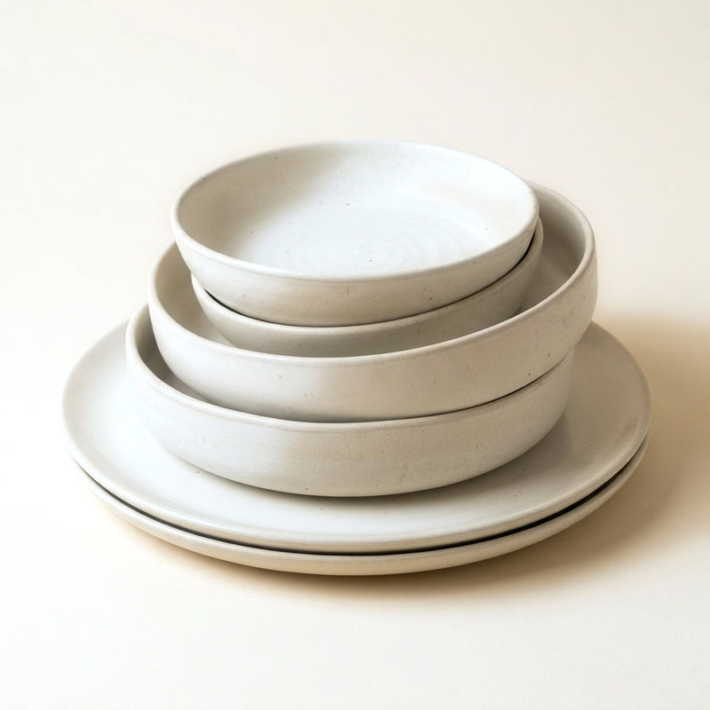 Table for Two set — six pieces of hand-glazed natural white stoneware, stacked: two large plates, two deep plates, two dessert plates